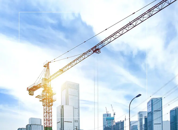 A crane is in the sky over some buildings.