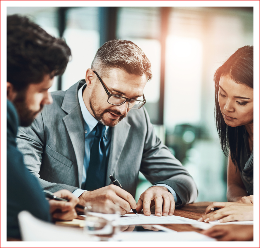 Business meeting with three people collaborating.